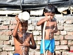 Children take bath on a hot summer day, in New Delhi on Saturday. (ANI Photo) Children take bath on a hot summer day, in New Delhi on Saturday. (ANI Photo)