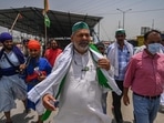 Bharatiya Kisan Union (BKU) leader Rakesh Tikait (C) walks with fellow protesting farmers during a demonstration against the recent price hike of fuel and LPG (Liquified Petroleum Gas) along a blocked highway as farmers continue to protest against the central government's recent agricultural reforms. Bharatiya Kisan Union (BKU) leader Rakesh Tikait (C) walks with fellow protesting farmers during a demonstration against the recent price hike of fuel and LPG (Liquified Petroleum Gas) along a blocked highway as farmers continue to protest against the central government's recent agricultural reforms.