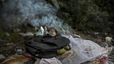Clothes of a deceased Covid-19 victim lie in a cremation ground in Guwahati on July 2. India’s devastating Covid-19 surge in April and May left crematoriums overwhelmed with pyres often lit around the clock. (Anupam Nath / AP) Clothes of a deceased Covid-19 victim lie in a cremation ground in Guwahati on July 2. India’s devastating Covid-19 surge in April and May left crematoriums overwhelmed with pyres often lit around the clock. (Anupam Nath / AP)