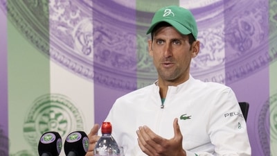 Wimbledon- Novak Djokovic's hilarious interview with the presenter left crowd in splits. (Pool via REUTERS)