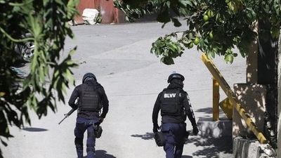 Police officers walk near the private residence of Haiti's President Jovenel Moise after he was shot dead by gunmen with assault rifles, in Port-au-Prince, Haiti. (REUTERS)