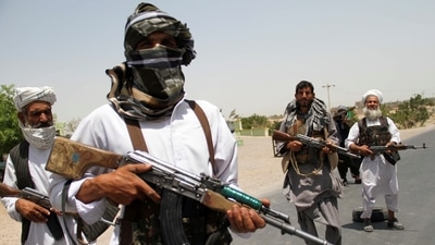 Former Mujahideen hold weapons to support Afghan forces in their fight against Taliban, on the outskirts of Herat province, Afghanistan. (Reuters)