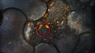 A bangle belonging worn by a deceased Covid-19 victim lies discarded in a cremation ground in Guwahati on July 2. Personal belongings of cremated Covid-19 victims lie strewn around the grounds of the Ulubari cremation ground in Guwahati, Assam’s capital. (Anupam Nath / AP) A bangle belonging worn by a deceased Covid-19 victim lies discarded in a cremation ground in Guwahati on July 2. Personal belongings of cremated Covid-19 victims lie strewn around the grounds of the Ulubari cremation ground in Guwahati, Assam’s capital. (Anupam Nath / AP)