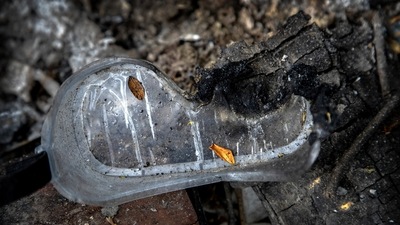 A pair of protective goggles of a deceased Covid-19 victim lies in a cremation ground in Guwahati on July 2. The belongings are left behind because of fear of touching them. They are scattered around the entire grounds of the Ulubari crematorium, particularly where the pyres are lit. (Anupam Nath / AP) A pair of protective goggles of a deceased Covid-19 victim lies in a cremation ground in Guwahati on July 2. The belongings are left behind because of fear of touching them. They are scattered around the entire grounds of the Ulubari crematorium, particularly where the pyres are lit. (Anupam Nath / AP)