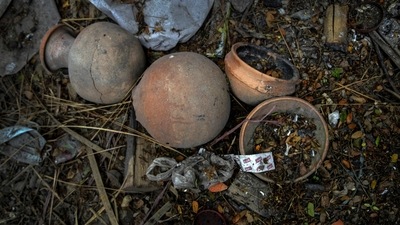 Earthen pots used during the cremation of a deceased Covid-19 victim lie in a cremation ground in Guwahati on July 2. Hindus believe cremation of the body frees the soul so it can be reborn, and they often burn belongings that were with the body at the time of the death, AP reported. (Anupam Nath / AP) Earthen pots used during the cremation of a deceased Covid-19 victim lie in a cremation ground in Guwahati on July 2. Hindus believe cremation of the body frees the soul so it can be reborn, and they often burn belongings that were with the body at the time of the death, AP reported. (Anupam Nath / AP)