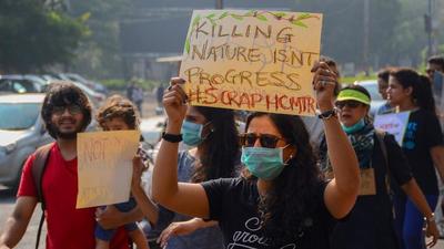 People carried out a protest against the proposed HCMTR project near Chaturshingi Temple in Pune. (Milind Saurkar/HT File Photo)