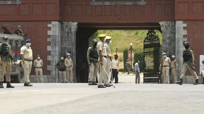 Police personnel on guard as members of the Delimitation Commission meet political leaders in Srinagar, Jammu and Kashmir. (HT Photo) Police personnel on guard as members of the Delimitation Commission meet political leaders in Srinagar, Jammu and Kashmir. (HT Photo)