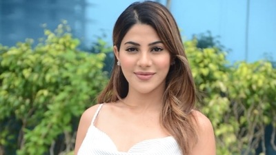 Nikki Tamboli poses for pictures after returning from Khatron Ke Khiladi shoot. 