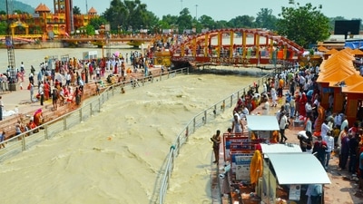 Devotees participate in Ganga Snan, in Haridwar on Friday. (ANI)