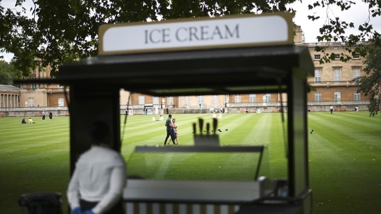 People walk through the The Garden of Buckingham Palace, during a preview day before it opens to the public, in London, Britain, July 8, 2021. Last month, officials said royal finances had taken a hit from the pandemic, losing out on the millions normally received from ticket sales.(REUTERS)