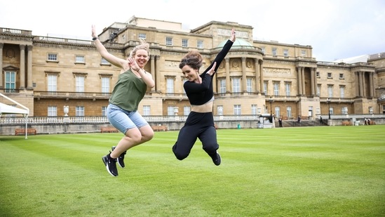 People pose for a photo in The Garden of Buckingham Palace, during a preview day before it opens to the public, in London, Britain, July 8, 2021. REUTERS/Henry Nicholls(REUTERS)
