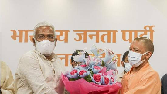 Uttar Pradesh chief minister and state BJP chief Swatantra Dev celebrate the party’s victory in the block pramukh polls (PTI Photo)