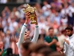 Serbia's Novak Djokovic holds the winner's trophy and celebrates his victory over Italy's Matteo Berrettini. Serbia's Novak Djokovic holds the winner's trophy and celebrates his victory over Italy's Matteo Berrettini.