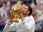Serbia's Novak Djokovic kisses the winners trophy after he defeated Italy's Matteo Berrettini in the men's singles final on day thirteen of the Wimbledon Championships in London. Serbia's Novak Djokovic kisses the winners trophy after he defeated Italy's Matteo Berrettini in the men's singles final on day thirteen of the Wimbledon Championships in London.