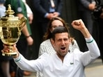 Wimbledon - Serbia's Novak Djokovic celebrates with the trophy after winning his final match against Italy's Matteo Berrettini.