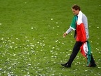 Italy coach Roberto Mancini walks on the pitch at the Wembley Stadium after winning Euro 2020 