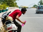A man washes his face to cope with the heat at Safdarjung flyover, in New Delhi on Saturday. A man washes his face to cope with the heat at Safdarjung flyover, in New Delhi on Saturday.