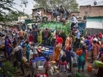 Residents collect water from a tanker in New Delhi’s Chanakyapuri on Sunday.
