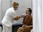 Passenger arriving in Finland may soon be fined hundreds of euros for refusing to take a coronavirus test.(Photo by Nenad MIHAJLOVIC/AFP) Passenger arriving in Finland may soon be fined hundreds of euros for refusing to take a coronavirus test.(Photo by Nenad MIHAJLOVIC/AFP)