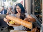 Mallika Sherawat poses with her meal at an eatery in Los Angeles.