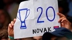 A fan holds a placard in support of Serbia's Novak Djokovic during the men's singles final match on day thirteen of the Wimbledon Tennis Championships in London.(AP) A fan holds a placard in support of Serbia's Novak Djokovic during the men's singles final match on day thirteen of the Wimbledon Tennis Championships in London.(AP)