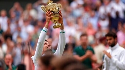 Serbia's Novak Djokovic holds the winner's trophy and celebrates his victory over Italy's Matteo Berrettini. (AP) Serbia's Novak Djokovic holds the winner's trophy and celebrates his victory over Italy's Matteo Berrettini. (AP)