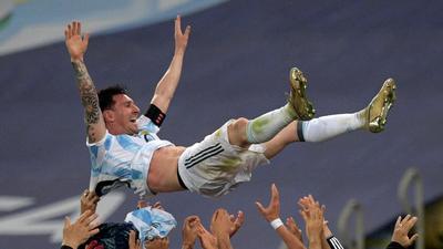 Argentina's Lionel Messi is thrown into the air by teammates after winning the Copa America final against Brazil at the Maracana Stadium. (AFP) Argentina's Lionel Messi is thrown into the air by teammates after winning the Copa America final against Brazil at the Maracana Stadium. (AFP)