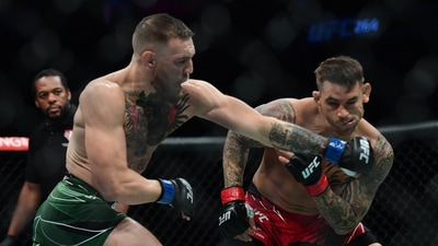 Conor McGregor moves in for a hit against Dustin Poirier during UFC 264 at T-Mobile Arena. (USA TODAY Sports)