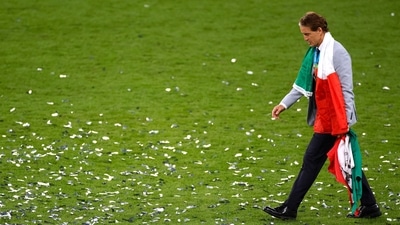 Italy coach Roberto Mancini walks on the pitch at the Wembley Stadium after winning Euro 2020 (Pool via REUTERS)
