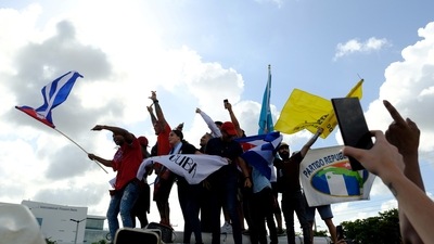 Emigres in Little Havana react to reports of protests in Cuba against the deteriorating economy. (Reuters)