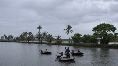 Members of a nomadic fishing community fish in backwaters during monsoon rains in Kochi, Kerala. (AP Photo)