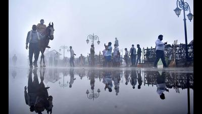 Tourists stroll on The Ridge in Shimla on Sunday. (Deepak Sansta/HT)