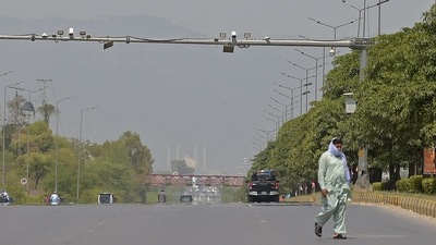 A man walks through a deserted Expressway in Islamabad (File Photo/AFP) A man walks through a deserted Expressway in Islamabad (File Photo/AFP)