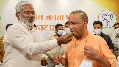 Uttar Pradesh chief minister Yogi Adityanath and BJP state president Swatantra Dev Singh celebrate victory in UP block panchayat elections, at party office in Lucknow, on Saturday. (PTI Photo) Uttar Pradesh chief minister Yogi Adityanath and BJP state president Swatantra Dev Singh celebrate victory in UP block panchayat elections, at party office in Lucknow, on Saturday. (PTI Photo)