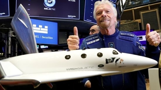 Sir Richard Branson poses on the floor of the New York Stock Exchange (NYSE) ahead of Virgin Galactic (SPCE) trading in New York, US. (REUTERS)