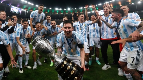 Argentina's Lionel Messi celebrates with the trophy after beating Brazil 1-0 in the Copa America final(AP)