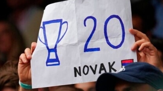 A fan holds a placard in support of Serbia's Novak Djokovic during the men's singles final match on day thirteen of the Wimbledon Tennis Championships in London.(AP) A fan holds a placard in support of Serbia's Novak Djokovic during the men's singles final match on day thirteen of the Wimbledon Tennis Championships in London.(AP)