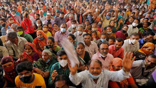Devotees sing religious hymns inside a temple in Ahmedabad on the eve of Rath Yatra, or chariot procession. (REUTERS/Amit Dave)