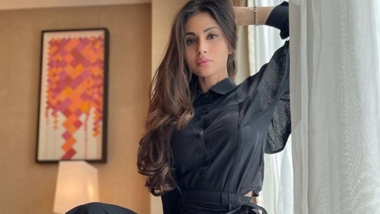 Mouni Roy in all-black crop blouse and flared pants reveals ways to her heart(Instagram/@imouniroy) Mouni Roy in all-black crop blouse and flared pants reveals ways to her heart(Instagram/@imouniroy)