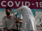 A medical worker administers a shot of Russia's Sputnik V coronavirus vaccine at a vaccination center in Gostinny Dvor, a huge exhibition place in Moscow, Russia.(AP) A medical worker administers a shot of Russia's Sputnik V coronavirus vaccine at a vaccination center in Gostinny Dvor, a huge exhibition place in Moscow, Russia.(AP)