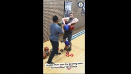The image shows the man creating a record with bowling balls.