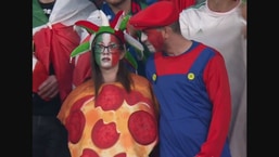 A couple dressed as pizza and Mario.