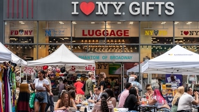 People shop at a street fair near Times Square in New York City, U.S., July 11, 2021. (REUTERS)