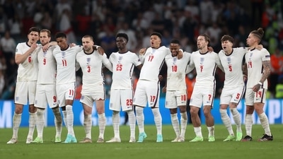 England players look on during a penalty shootout (Pool via REUTERS)