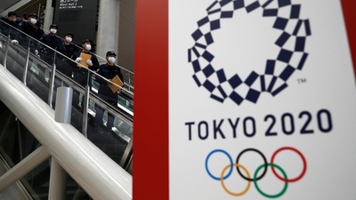 Police officers conduct a security sweep of the Tokyo Olympic Main Press Center in Tokyo. (REUTERS)
