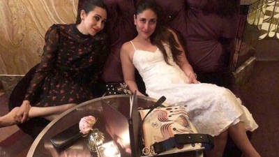 The sisters love spending quality time together. In this still, Karisma can be seen wearing a black dress while Bebo looked stunning in a white dress. (Instagram/@therealkarismakapoor)