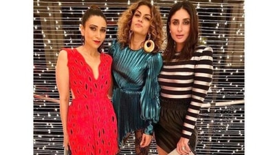 Party goers can take inspiration from this look of the Kapoor sisters. Karisma looked drop-dead gorgeous in a red deep-neck dress while Kareena rocked the black and grey look. (Instagram/@therealkarismakapoor)