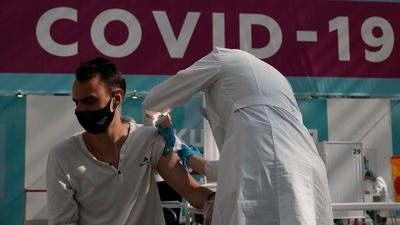 A medical worker administers a shot of Russia's Sputnik V coronavirus vaccine at a vaccination center in Gostinny Dvor, a huge exhibition place in Moscow, Russia. (AP) A medical worker administers a shot of Russia's Sputnik V coronavirus vaccine at a vaccination center in Gostinny Dvor, a huge exhibition place in Moscow, Russia. (AP)