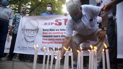 Members of The Bombay Catholic Sabha hold a memorial mass outside St Peter's Church in Bandra in a protest holding banners and lighting candles for Father Stan Swamy who died on July 5, in Mumbai on July 6. (HT file) Members of The Bombay Catholic Sabha hold a memorial mass outside St Peter's Church in Bandra in a protest holding banners and lighting candles for Father Stan Swamy who died on July 5, in Mumbai on July 6. (HT file)