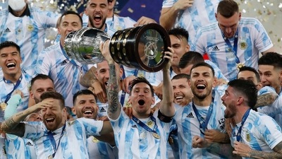 Argentina's Lionel Messi hoists the trophy after beating Brazil 1-0 in the Copa America final. (AP) Argentina's Lionel Messi hoists the trophy after beating Brazil 1-0 in the Copa America final. (AP)